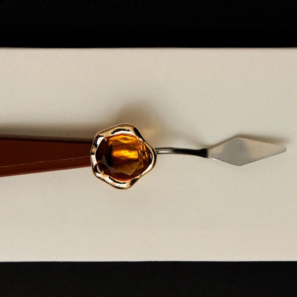 ANEL CURVO COM CRISTAL OVAL AMARELO